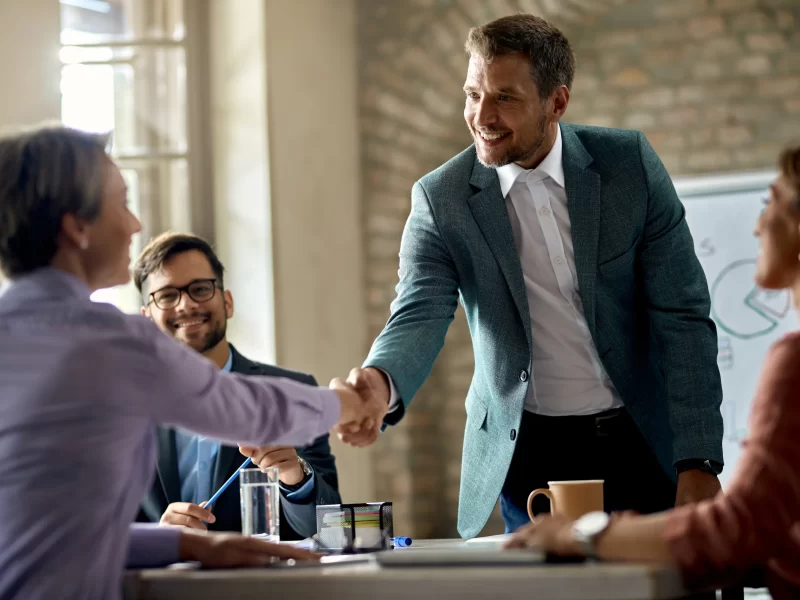 business-coworkers-shaking-hands-meeting-office-focus-is-businessman